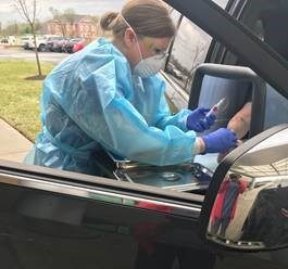 nurse at car